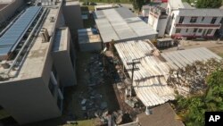 An aerial view looks over the Flamengo soccer club training complex where an early-morning fire left 10 people dead and three injured in Rio de Janeiro, Brazil, Feb. 8, 2019.
