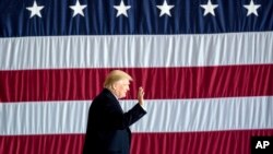 President-elect Donald Trump arrives for a rally in a DOW Chemical Hanger at Baton Rouge Metropolitan Airport, Dec. 9, 2016, in Baton Rouge, Louisiana.