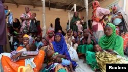 Internally displaced Somali women wait for medicine at a Save the Children UK clinic at their camp in Hodan district of Somalia's capital Mogadishu, Nov. 21, 2012. 