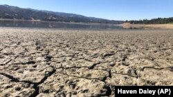 An exposed dry bed is seen at Lake Mendocino near Ukiah, Calif., Wednesday, Aug. 4, 2021. (AP Photo/Haven Daley)
