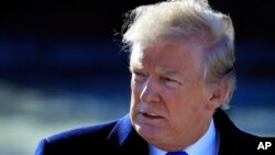 President Donald Trump walks on the South Lawn as he leaves the White House in Washington, Jan. 5, 2018, en route to Camp David, Md., to participate in a Republican leadership retreat.
