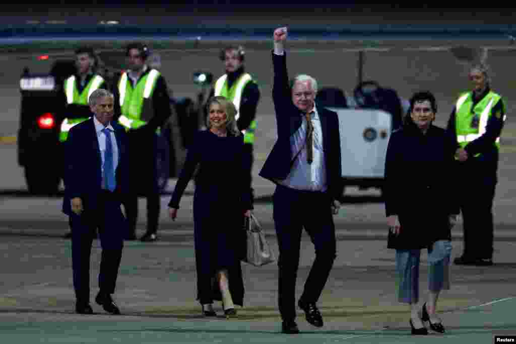 WikiLeaks founder Julian Assange gestures as he arrives in Canberra, Australia, June 26, 2024. Assange was released by a court on the U.S. Pacific island territory of Saipan after pleading guilty&nbsp;to violating U.S. espionage law.