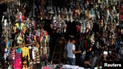 People shop at Al-Ataba, a popular market in downtown Cairo, Nov. 11, 2013. 