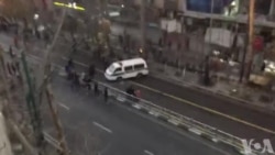 Protesters Overturn Iranian Police Van