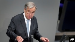 FILE - UN Secretary-General Antonio Guterres delivers a speech during a meeting of the German federal parliament, Bundestag, at the Reichstag building in Berlin, Germany, Dec. 18, 2020. (AP Photo/Michael Sohn)