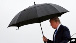 President Donald Trump walks down the steps of Air Force One at Osaka International (Itami) Airport, in Osaka, Japan, June 27, 2019. Trump is in Osaka to attend the G-20 summit. 
