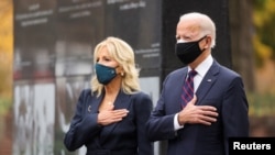 U.S. President-elect Joe Biden, accompanied by his wife Jill, attends a Veterans Day observance in Philadelphia, Pennsylvania, Nov. 11, 2020.