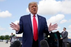 President Donald Trump speaks to reporters before boarding Air Force One for a trip to Jupiter, Fla., Sept. 8, 2020.