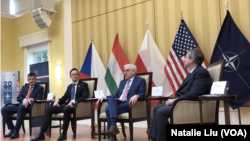 Czech, Hungarian and Polish Foreign Ministers Tomáš Petříček, Péter Szijjártó and Jacek Czaputowicz,(L-R) speak at event held at the Polish Ambassador’s residence in Washington on April 4, 2019.