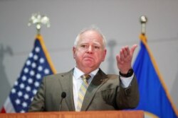 FILE - Minnesota Governor Tim Walz speaks in St. Paul, Minnesota, April 20, 2021.