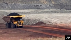 FILE - A dump truck hauls coal at Contura Energy's Eagle Butte Mine near Gillette, Wyo., March 28, 2017. Mine owner Blackjewel says it has filed for Chapter 11 bankruptcy protection. It operates mines in Wyoming, Kentucky, Virginia and West Virginia.