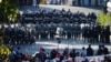 Police officers stand guard during a protest over the government's handling of the coronavirus disease (COVID-19) pandemic, in Bangkok, Thailand, Aug. 16, 2021.