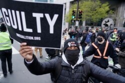 People celebrate after a guilty verdict was announced at the trial of former Minneapolis police Officer Derek Chauvin for the 2020 death of George Floyd, April 20, 2021, in Minneapolis, Minn.