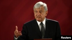 FILE - Mexican President Andres Manuel Lopez Obrador holds a news conference at the National Palace in Mexico City, Dec. 3, 2018. 