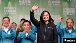 Incumbent Taiwan President Tsai Ing-wen waves to supporters after her election victory at a rally, outside the Democratic Progressive Party (DPP) headquarters, in Taipei, Taiwan, Jan. 11, 2020.