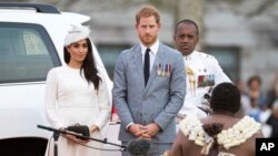 FILE - Prince Harry, Duke of Sussex and Meghan, Duchess of Sussex attend an official welcome ceremony in Albert Park on October 23, 2018 in Suva, Fiji