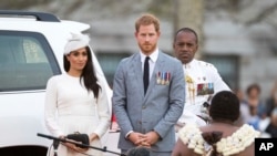 FILE - Prince Harry, Duke of Sussex and Meghan, Duchess of Sussex attend an official welcome ceremony in Albert Park on October 23, 2018 in Suva, Fiji
