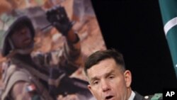 U.S. Lieutenant General William B. Caldwell, head of the NATO Training Mission in Afghanistan, addresses a news conference in Brussels, March 3, 2010.