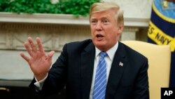President Donald Trump speaks during a meeting in the Oval Office of the White House, July 2, 2018, in Washington.