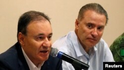 Mexico's Security Minister Alfonso Durazo and Sinaloa Gov. Quirino Ordaz Coppel hold a news conference a day after cartel gunmen clashed with federal forces, resulting in the release of Ovidio Guzman from detention, in Culiacan, Sinaloa, Oct. 18, 2019.