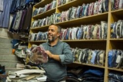 Hussain, a 42-year-old shopkeeper says his city has been ruled by four different groups since 2011, including Islamic State militants, Aug. 30, 2019 in Manbij, Syria. (VOA/Yan Boechat)