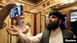 FILE - Taliban spokesman Suhail Shaheen leaves after a news conference in Moscow, Russia, July 9, 2021.