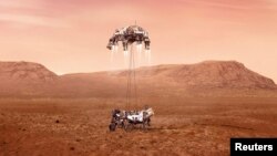 Perseverance rover is shown to be lowered to Martian surface 