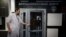 RUSSIA -- A staff member opens a door for journalists during a visit to Russia's national drug-testing laboratory in Moscow, May 24, 2016