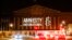 The logo of NGO Amnesty International is projected onto the Palais Bourbon, the seat of the French national assembly, late on June 18, 2018. 