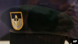 FILE - A "green beret" is seen at the John F. Kennedy Library and Museum in Boston. A former U.S. Army Special Forces officer who served in the Green Berets pleaded guilty Nov. 18, 2020, to charges of providing military information to Russian agents.