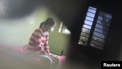 FILE - An HIV-positive patient rests at the Khmer-Soviet Hospital in Phnom Penh, Nov. 29, 2011.