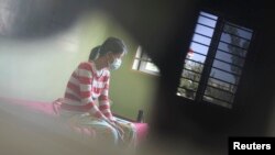 FILE - An HIV-positive patient rests at the Khmer-Soviet Hospital in Phnom Penh.