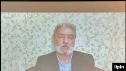 In this image from a video message, former Iranian political prisoner Abbas Vahedian Shahroudi addresses a human rights conference hosted by Washington's National Press Club on June 30, 2021. (Michael Lipin/VOA)