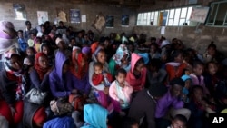 FILE - Eritrean refugees wait to get registered on arrival at the Indabaguna refugee reception and screening center in Tigrai region near the Eritrean border in Ethiopia, Feb. 9, 2016.