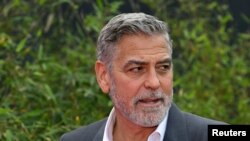 Aktor dan aktivis hak asasi manusia George Clooney di Duesseldorf, Jerman barat pada 24 Mei 2023. (Foto: INA FASSBENDER via REUTERS)