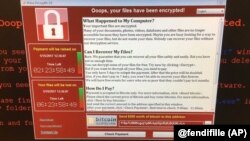 This image provided by the Twitter page of @fendifille shows a computer at Greater Preston CCG as Britain’s National Health Service is investigating “an issue with IT,” May 12, 2017. Hospitals, businesses and organizations around the world reported proble