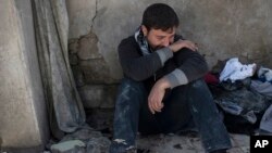An Iraqi man cries next to houses where he says 23 members of his family were killed during fighting with Islamic State in western Mosul, Iraq, March 24, 2017. Residents of the Mosul neighborhood known as Jidideh say that scores of residents were killed by airstrikes earlier this month.
