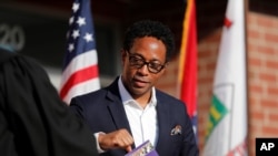 FILE - St. Louis County Prosecuting Attorney Wesley Bell is seen during an inauguration ceremony for Mayor Ella Jones on June 17, 2020, in Ferguson, Mo. 