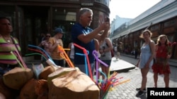 Tourists stroll through Havana, Cuba, May 15, 2017. 