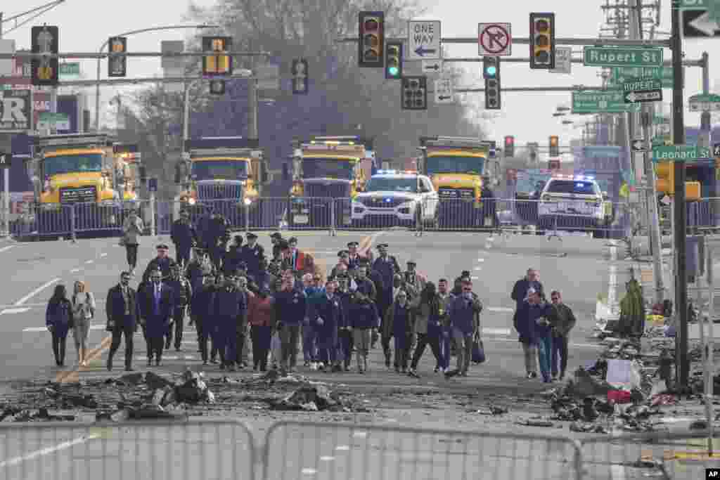 Pennsylvania Gov. Josh Shapiro, Philadelphia Mayor Cherelle Parker and other officials view the aftermath of a fatal small plane crashed in Philadelphia.