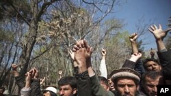 In Kabul, students shout anti-U.S. slogans during a protest against the burning of a Koran supervised by Florida-based militant fundamentalist Christian preacher, April 5, 2011