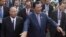 Cambodia's Prime Minister and President of the People's Party, Hun Sen, center, arrives at an event marking the 38th anniversary of the 1979 downfall of the Khmer Rouge regime in Phnom Penh, Cambodia, Saturday, Jan. 7, 2017. (AP Photo/Heng Sinith)
