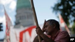 Under the slogan: "There is another way", unions, and political and social groups, gather to protest against the proposed 2019 budget they refer to as the budget of "hunger, misery and unemployment," in Buenos Aires, Argentina, Nov. 14, 2018. 