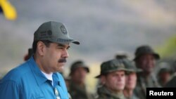 រូបឯកសារ៖ ប្រធានា​ធិបតី​វេណេស៊ុយអេឡា Nicolas Maduro ចូលរួម​ក្នុង​ពិធី​ហ្វឹក​ហាត់​យោធា​នៅ​ក្រុង Turiamo កាល​ពី​ថ្ងៃទី​៣ កុម្ភៈ ២០១៩។