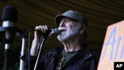 FILE - In this August 2014 photo provided by WXPN, Gene Shay performs during the Philadelphia Folk Festival. 