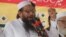 Hafiz Saeed, leader of Jamaat-ud-Dawa address an anti-Indian rally in Lahore, Pakistan, Sept. 30, 2016. 