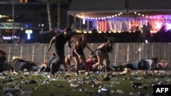 People run from the Route 91 Harvest country music festival after apparent gun fire was heard on October 1, 2017 in Las Vegas, Nevada.