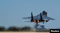 FILE - A Republic of Korea Air Force F-15K Slam Eagles fighter plane takes off during Exercise Max Thunder 17 at Gunsan Air Base, South Korea, April 27, 2017. 