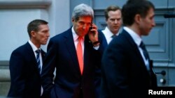 U.S. Secretary of State John Kerry makes a phonecall after a meeting in Vienna, Nov. 21, 2014.