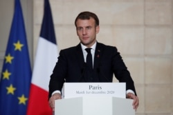 French President Emmanuel Macron looks on during a press conference with the Belgium's Prime Minister after a meeting at the Elysee Palace in Paris, on Dec. 1, 2020.
